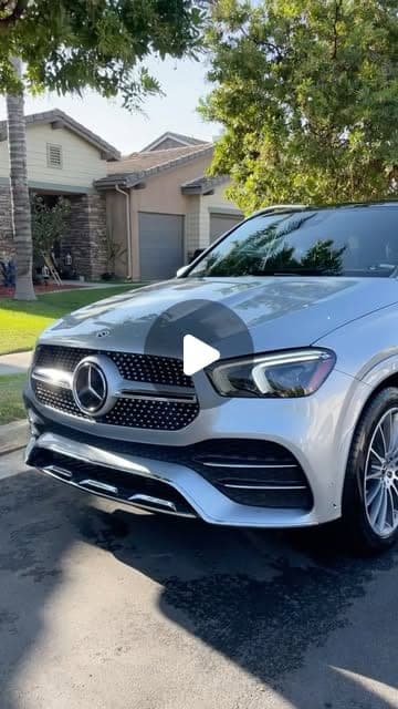 Silver Mercedes GLE in a driveway, from a reel