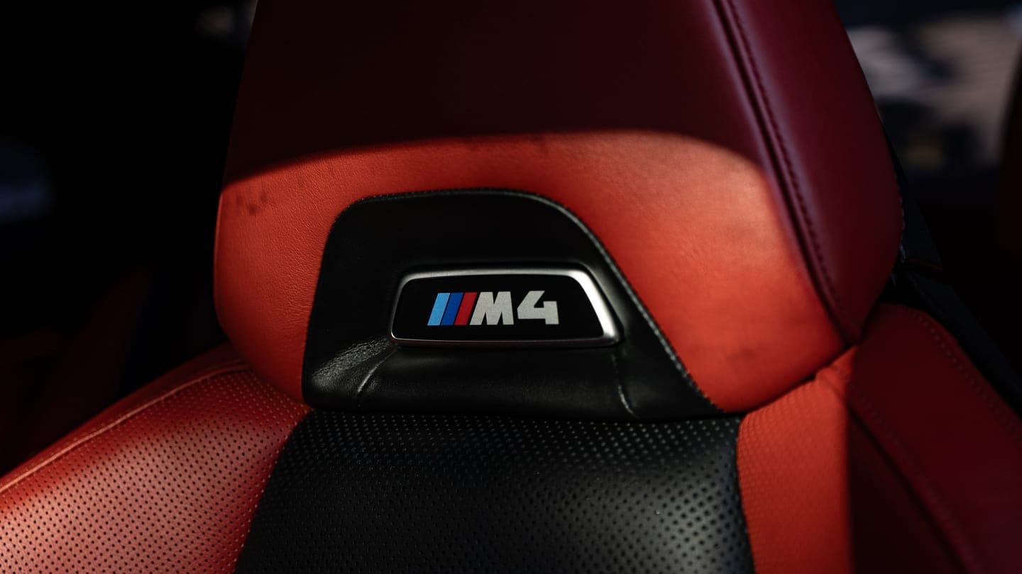 Red leather M4 seat with the M badge, cleaned and conditioned